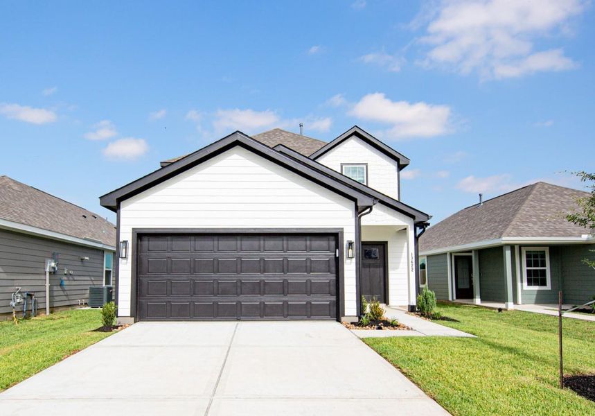 Front exterior of a new home in Townsend Reserve, Splendora, TX, highlighting curb appeal (Image 2). Front exterior of a new home in Townsend Reserve, Splendora, TX, highlighting curb appeal (Image 2).