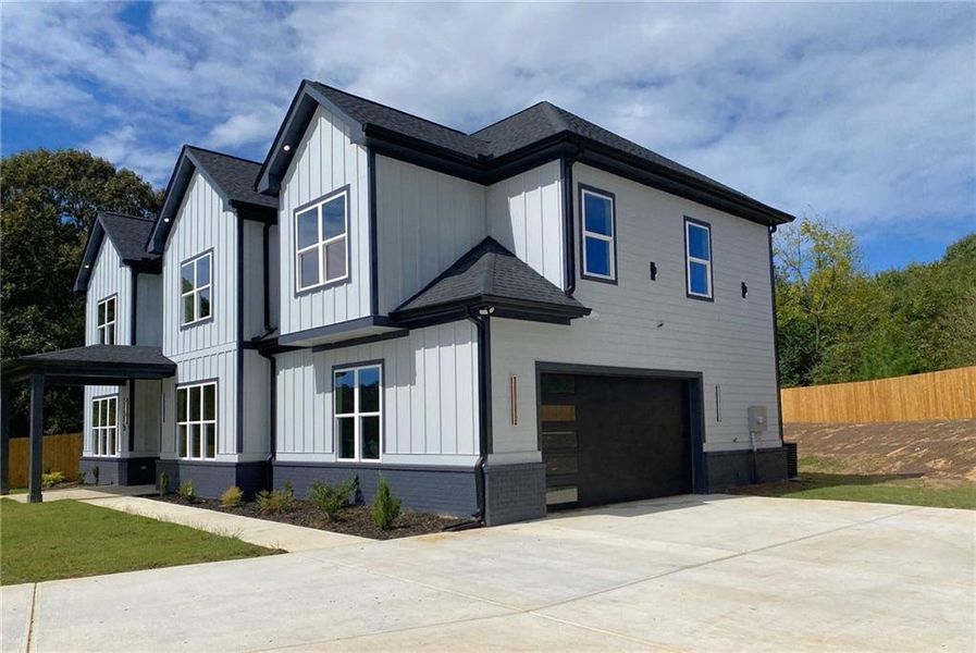 Front exterior of a new home in , Snellville, GA, highlighting curb appeal (Image 2).