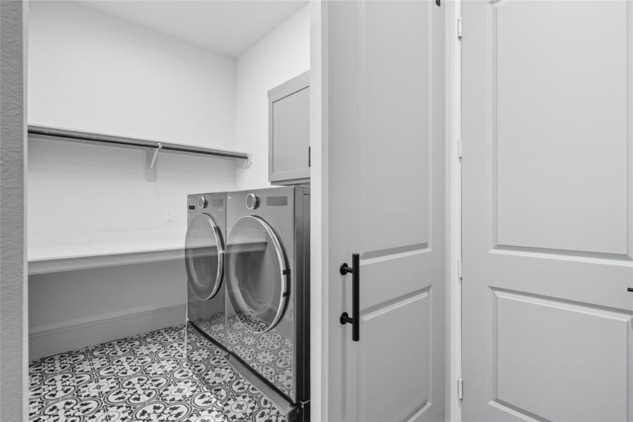 Laundry and utility room upon entering from garage. Laundry and utility room upon entering from garage.