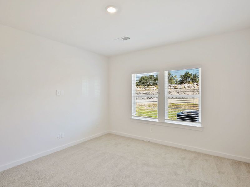 The primary suite offers a private retreat.