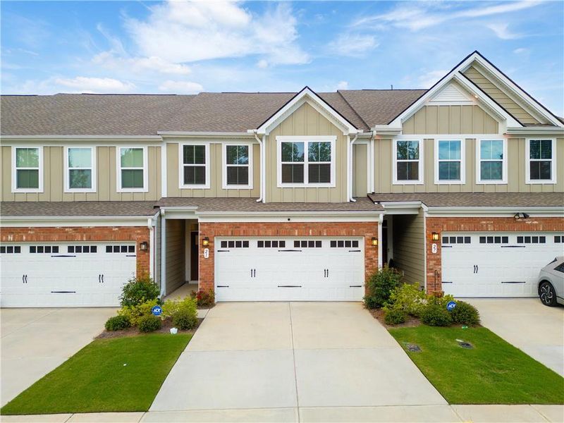 Front exterior of a new home in , Hoschton, GA, highlighting curb appeal (Image 2).