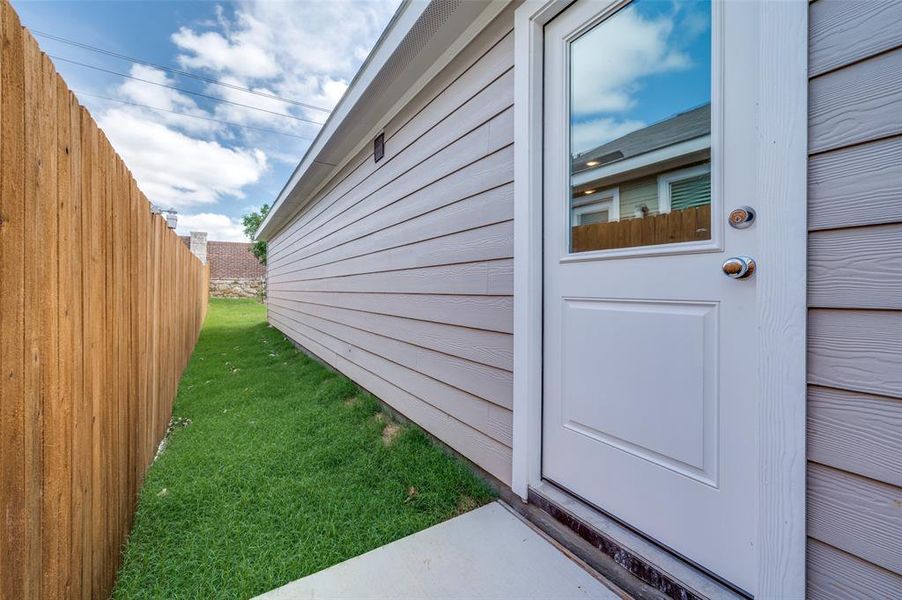 Property entrance featuring a yard Property entrance featuring a yard