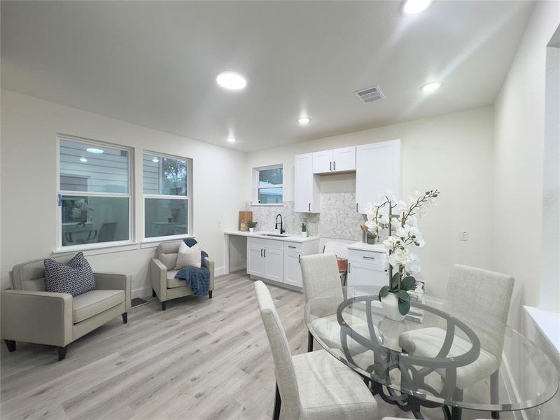 Dining room featuring light hardwood / wood-style floors and sink