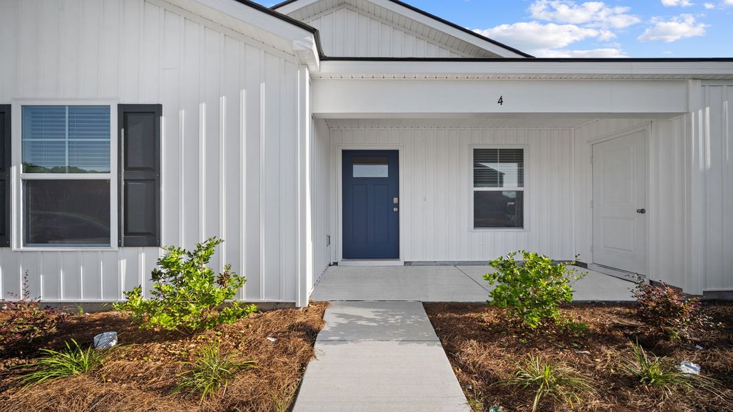 Front exterior of a new home in Rice Hope, Port Wentworth, GA, highlighting curb appeal (Image 2). Front exterior of a new home in Rice Hope, Port Wentworth, GA, highlighting curb appeal (Image 2).