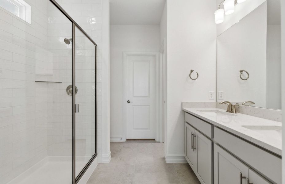 Owner's bath with double vanity and spacious shower Owner's bath with double vanity and spacious shower
