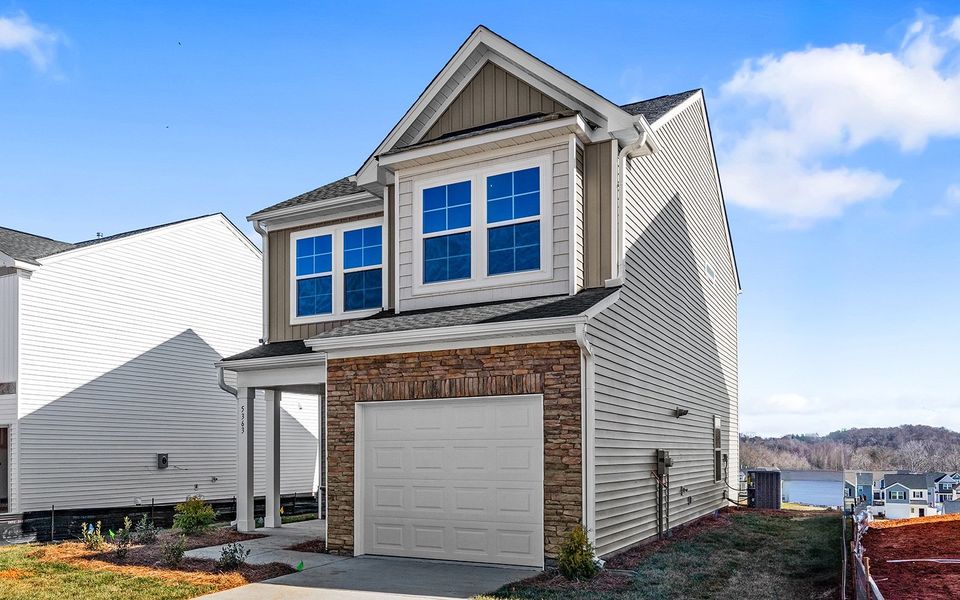 Front exterior of a new home in Hanes Lake, Winston-Salem, NC, highlighting curb appeal (Image 20).