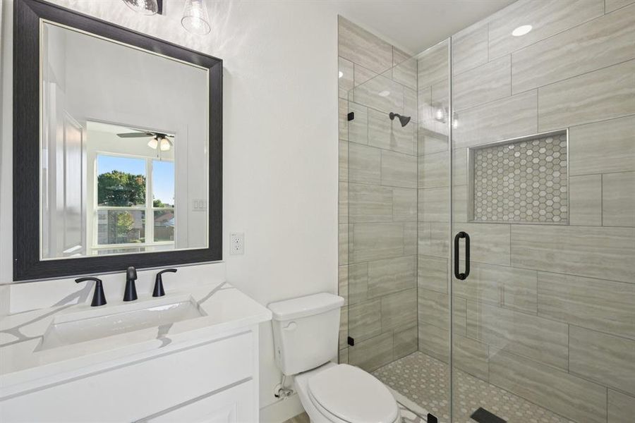Full bathroom with a stall shower and vanity