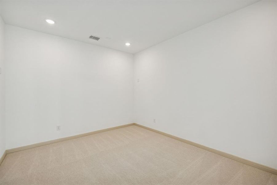 This spacious media room with adjacent game room create the ultimate family entertainment zone!