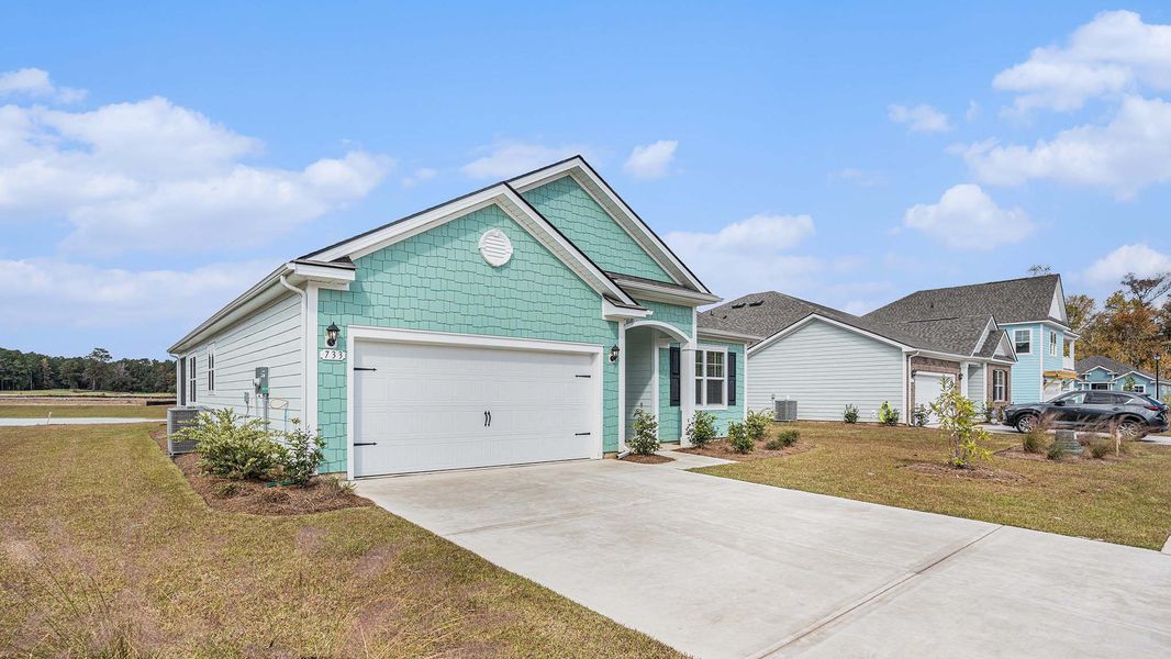 Front exterior of a new home in Eden Springs, Longs, SC, highlighting curb appeal (Image 14).