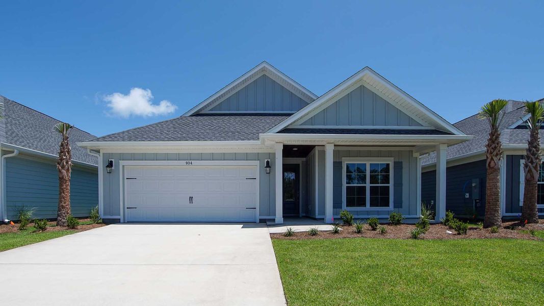 Front exterior of a new home in Breakfast Point East Phase I, Panama City Beach, FL, highlighting curb appeal (Image 1).