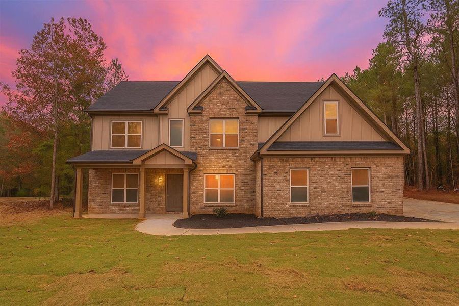Front exterior of a new home in , Loganville, GA, highlighting curb appeal (Image 27).