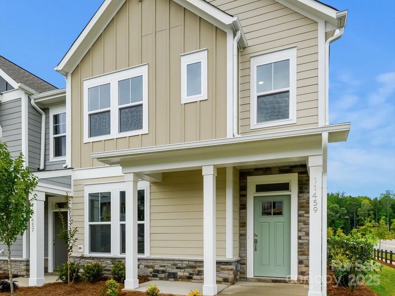 Front exterior of a new home in North Creek Village - Townhomes, Huntersville, NC, highlighting curb appeal (Image 1). Front exterior of a new home in North Creek Village - Townhomes, Huntersville, NC, highlighting curb appeal (Image 1).