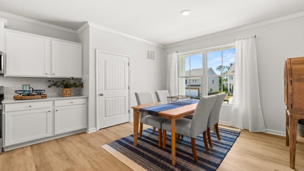 Furnished interior view inside a new home in Waypoint, Flowery Branch (Image 11).