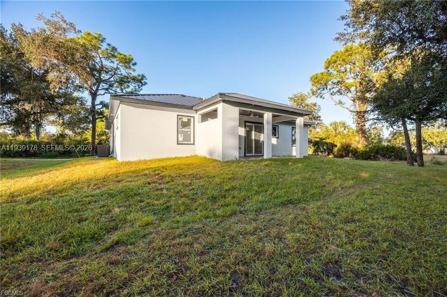 Exterior details and patio area of a home in , Labelle (Image 25).