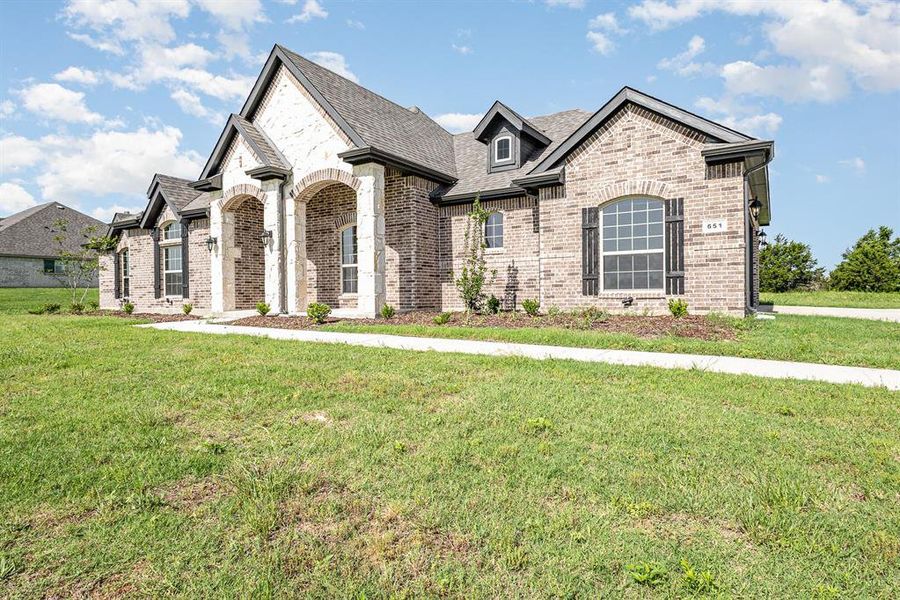 Front exterior of a new home in , Waxahachie, TX, highlighting curb appeal (Image 17).