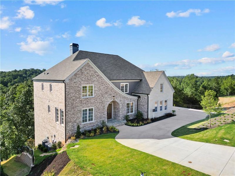 Front exterior of a new home in , Suwanee, GA, highlighting curb appeal (Image 30).