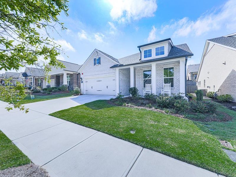 Front exterior of a new home in Glenhaven at Ridgewalk, Woodstock, GA, highlighting curb appeal (Image 32).