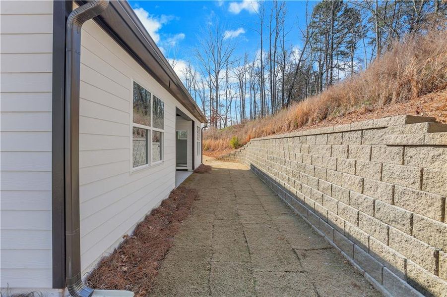 Exterior details and patio area of a home in Marble Tree, Ball Ground (Image 24).