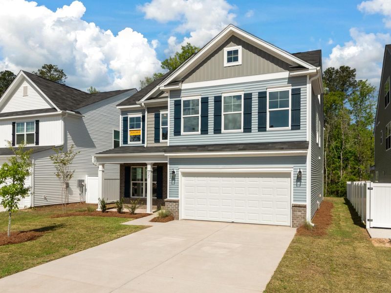 Front exterior of a new home in Parker's Preserve, Ridgeville, SC, highlighting curb appeal (Image 2).