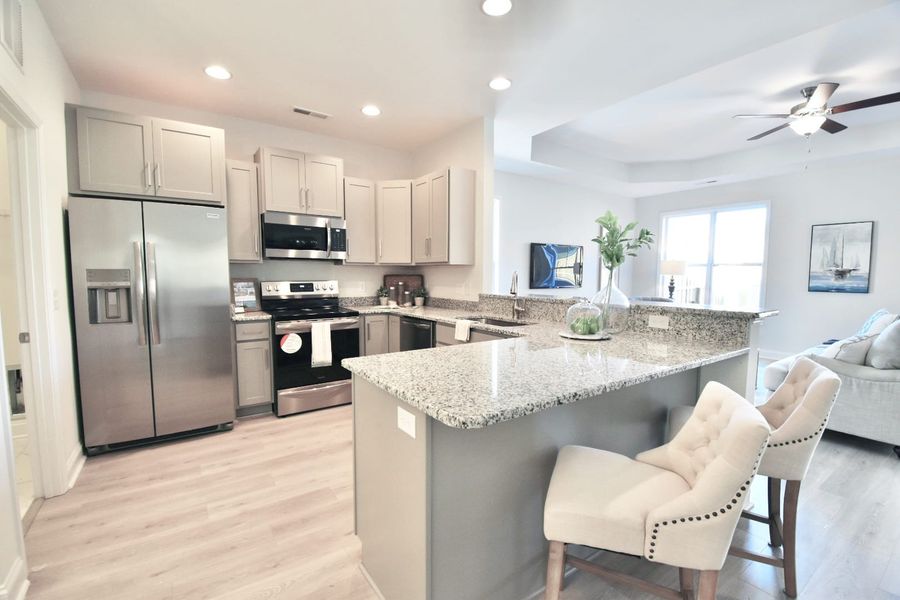 Representative furnished interior of a home built from the Isla by Stevens Fine Homes in Parkwood Estates, Leland (Image 6).