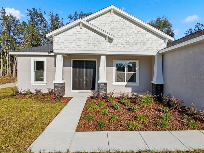 Front exterior of a new home in , Citrus Springs, FL, highlighting curb appeal (Image 28).