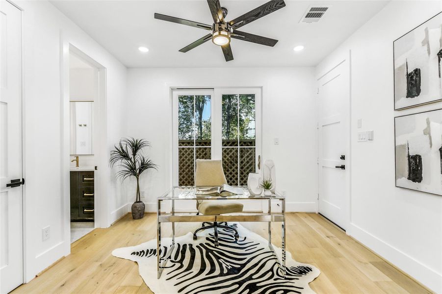 Designed with productivity and tranquility in mind,this elegant home office or flex suite features glassdoors, a ceiling fan with designer lighting, andaccess to a private patio. Ideal for telemedicinesessions, study time for residents, or executive-level work-from-home days, it embodies theperfect fusion of focus and comfort.