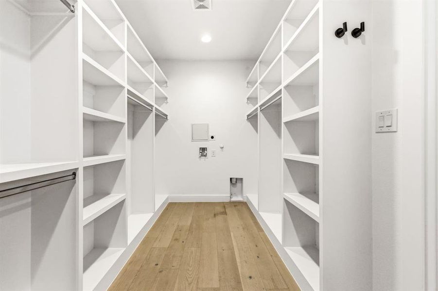 Walk in closet featuring light wood-style floors