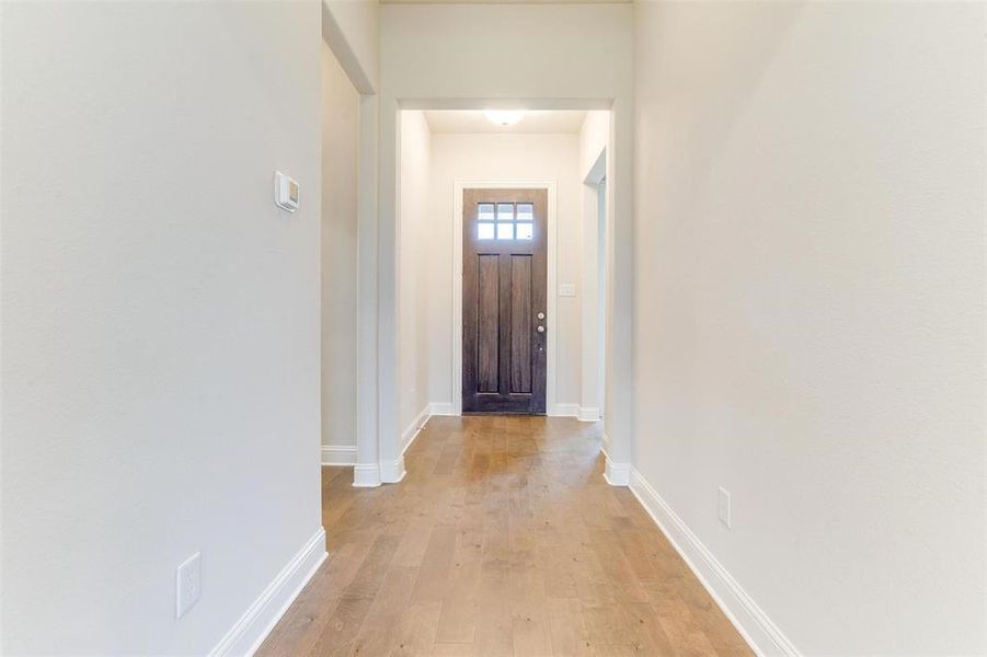 Doorway featuring light wood-type flooring