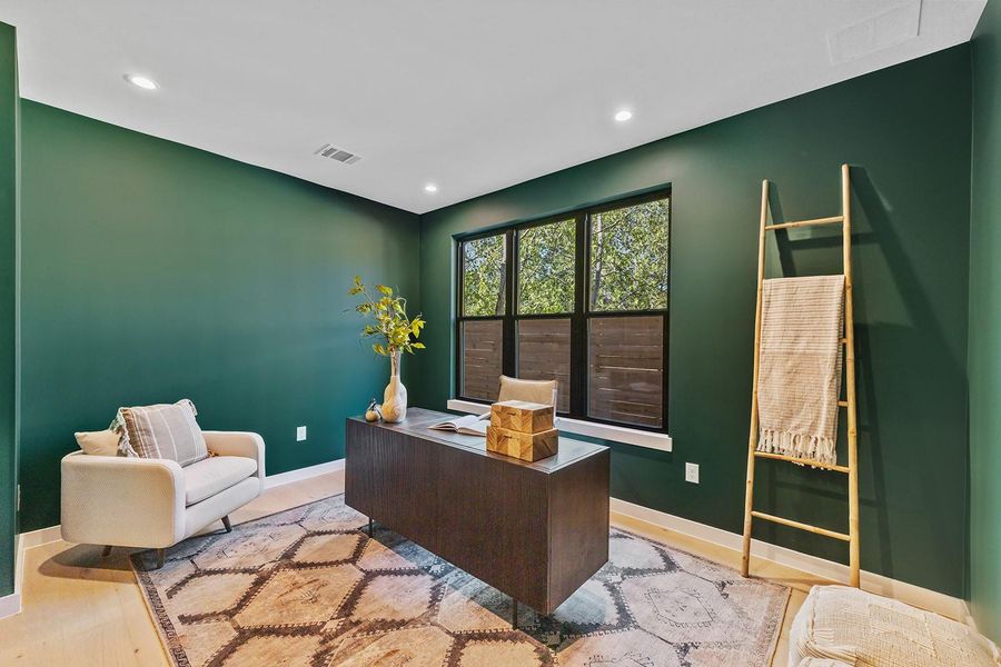 Office space featuring wood finished floors and recessed lighting