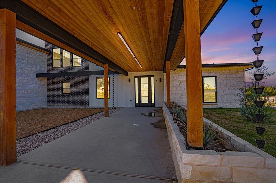 Patio terrace at dusk with a patio and a yard Patio terrace at dusk with a patio and a yard