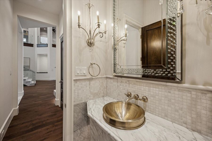This photo features one of two half bathrooms in the home, finished with high-quality fixtures and a stylish design. This photo features one of two half bathrooms in the home, finished with high-quality fixtures and a stylish design.