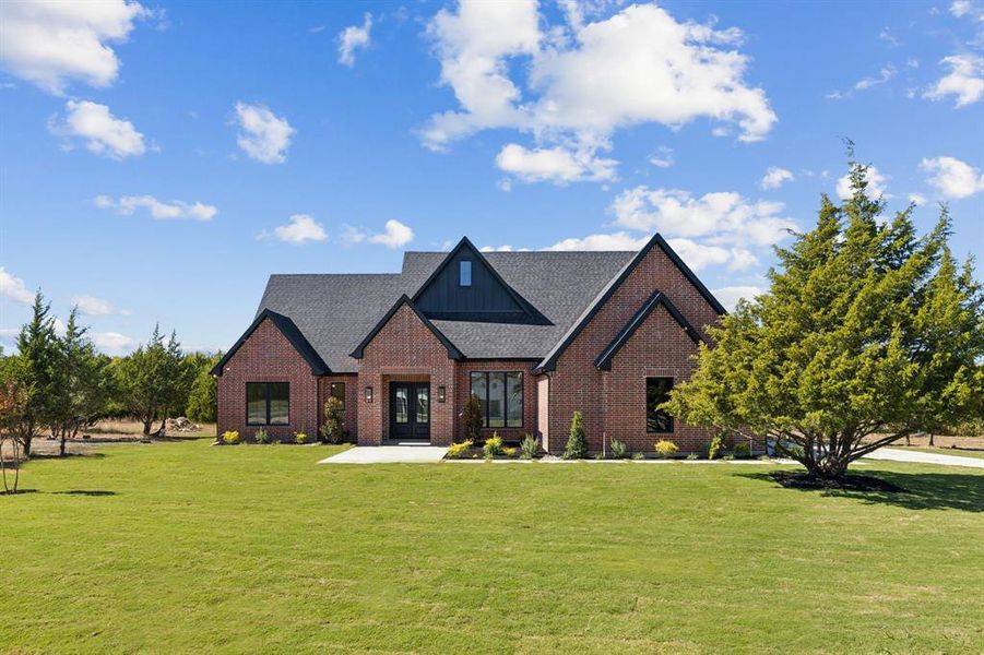 Front exterior of a new home in , Waxahachie, TX, highlighting curb appeal (Image 1). Front exterior of a new home in , Waxahachie, TX, highlighting curb appeal (Image 1).
