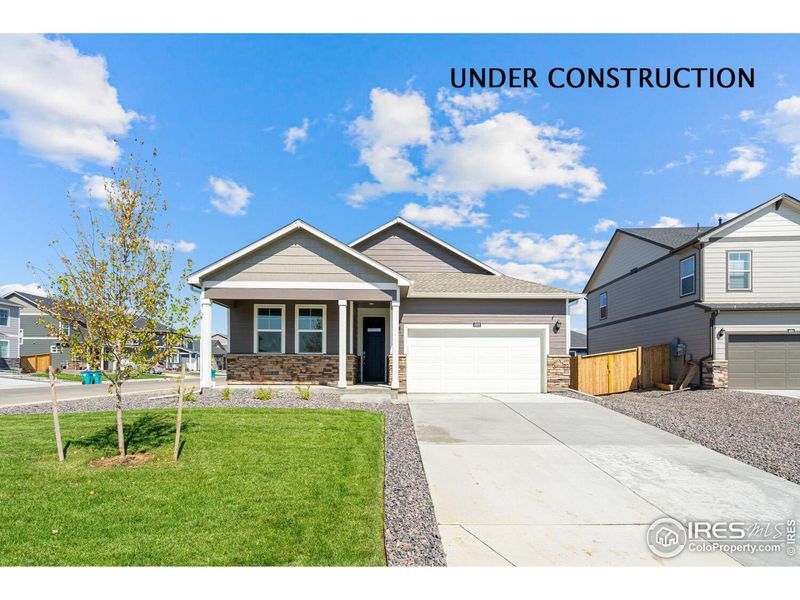 Front exterior of a new home in Tailholt, Severance, CO, highlighting curb appeal (Image 1).