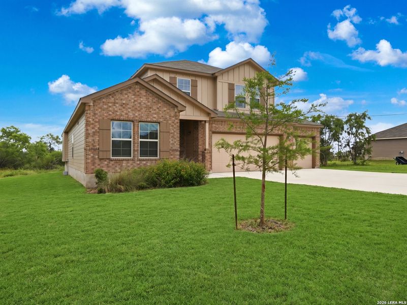 Front exterior of a new home in Chaparral Ranch, Floresville, TX, highlighting curb appeal (Image 2). Front exterior of a new home in Chaparral Ranch, Floresville, TX, highlighting curb appeal (Image 2).