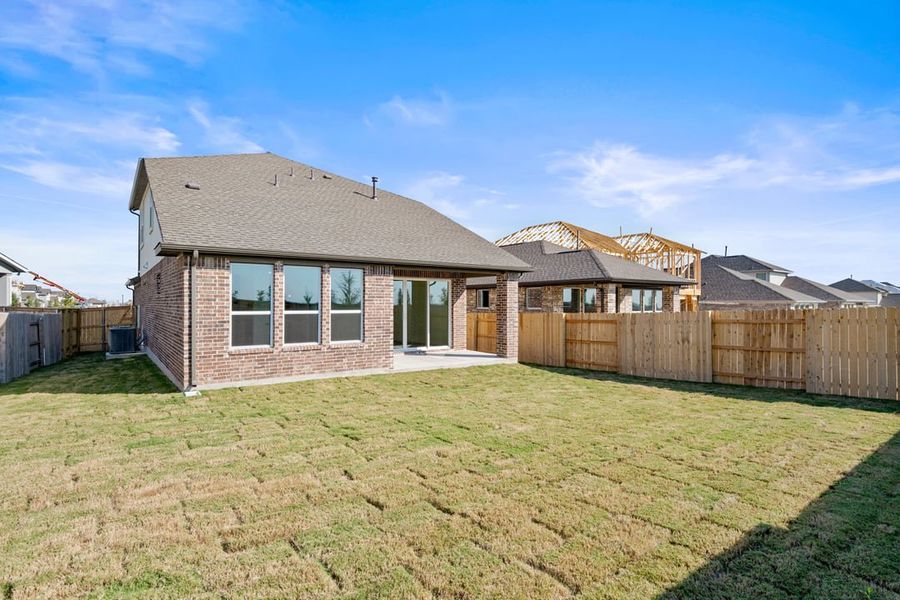 Exterior details and patio area of a home in Flora, Hutto (Image 25).