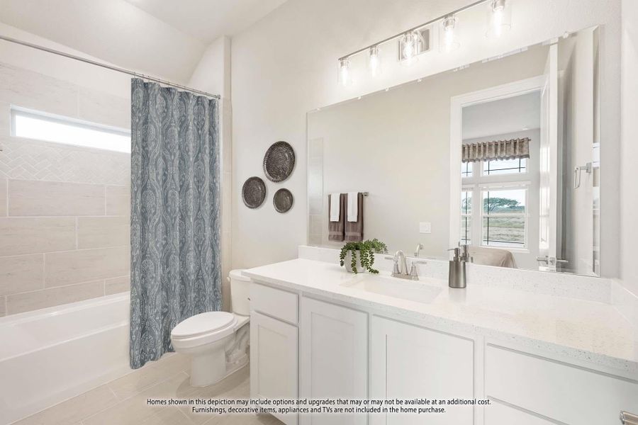 Bathroom with white vanity, large mirror, and tub-shower combo with tile surround and blue curtain Bathroom with white vanity, large mirror, and tub-shower combo with tile surround and blue curtain