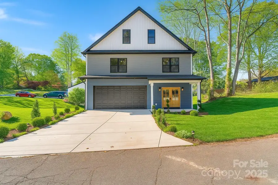 Front exterior of a new home in , Hickory, NC, highlighting curb appeal (Image 1).