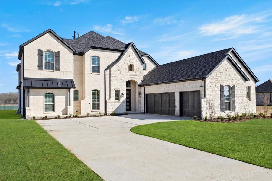 Representative exterior photo of a completed home built from the Davenport by Windsor Homes in Winding Creek, Rockwall, TX (Image 2).