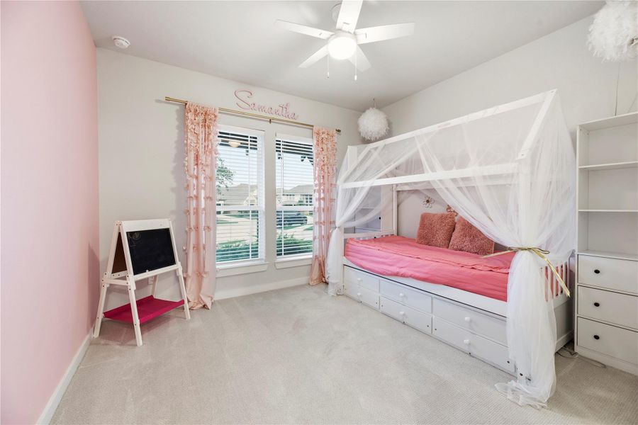 This is the second bedroom found on the first floor of the home. It has it's own private en suite bathroom and features a fan and recently professionally cleaned carpet.