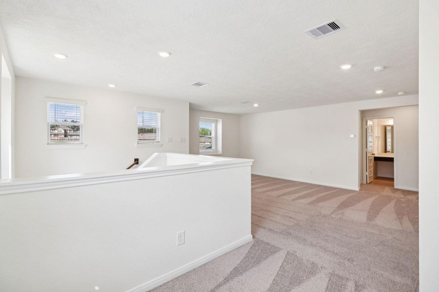 Additional Game Room views that leads you to the hallway of the secondary bedrooms and bathroom.