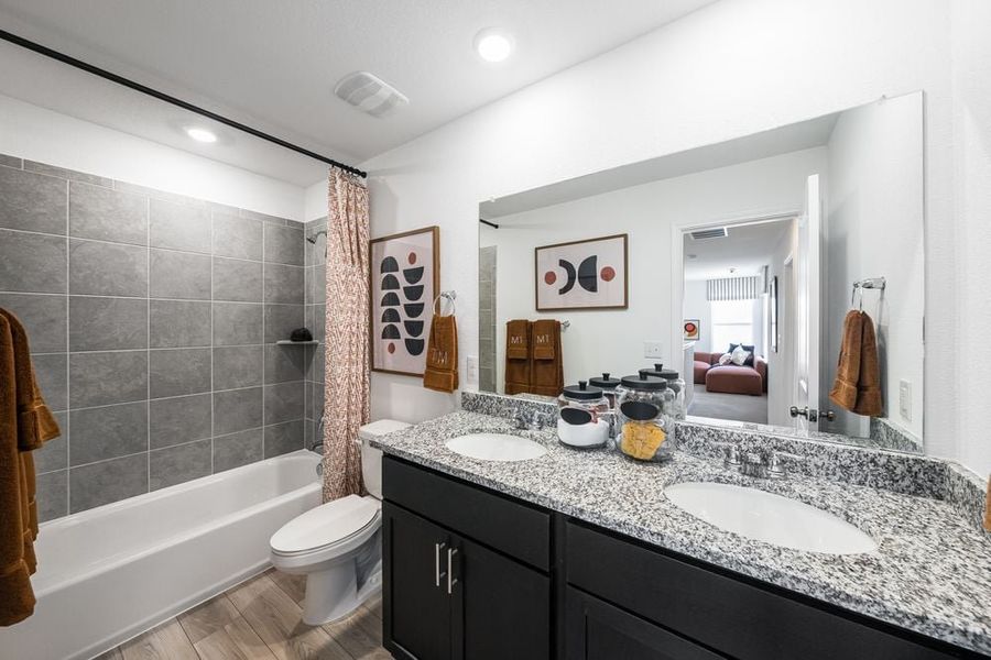 Representative furnished interior of a home built from the Kestrel by Taylor Morrison in Longview 40s, Del Valle (Image 25).