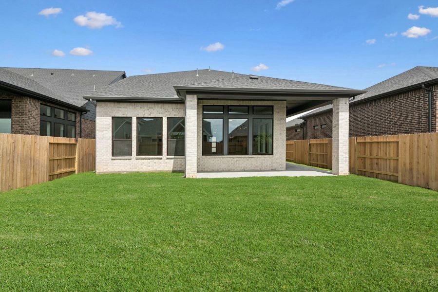 Front exterior of a new home in Grange 45' Homesites, Katy, TX, highlighting curb appeal (Image 26). Front exterior of a new home in Grange 45' Homesites, Katy, TX, highlighting curb appeal (Image 26).