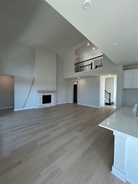 From Kitchen to Family Room with soaring ceiling & fireplace