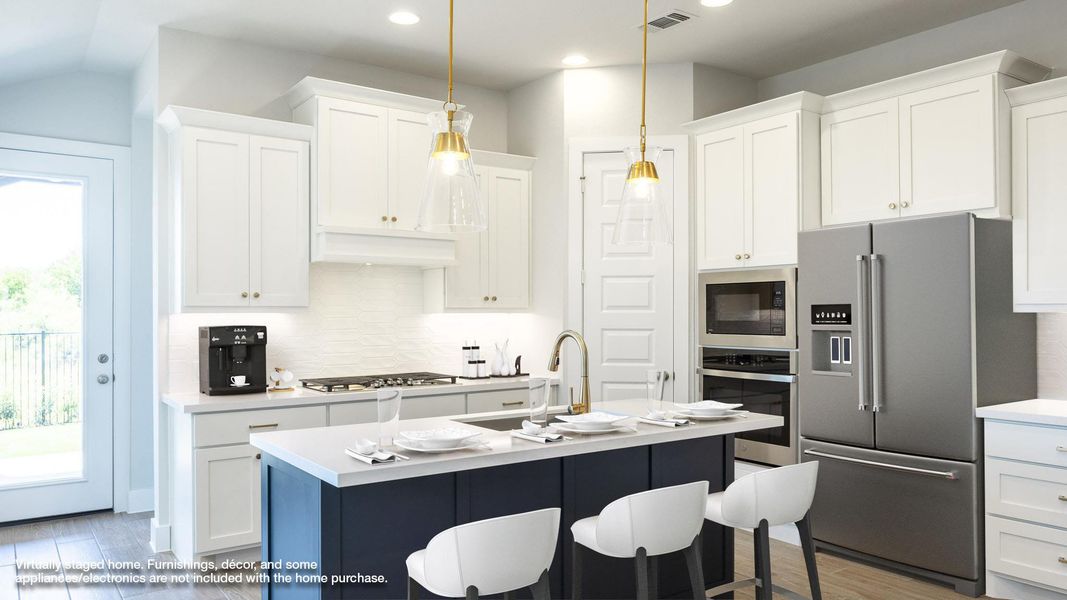 Kitchen featuring light wood-type flooring, stainless steel appliances, white cabinets, and recessed lighting
