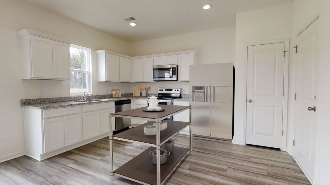 Representative furnished interior of a home built from the Copernicus by Starlight Homes in Crescent Pointe, Carrollton (Image 5).