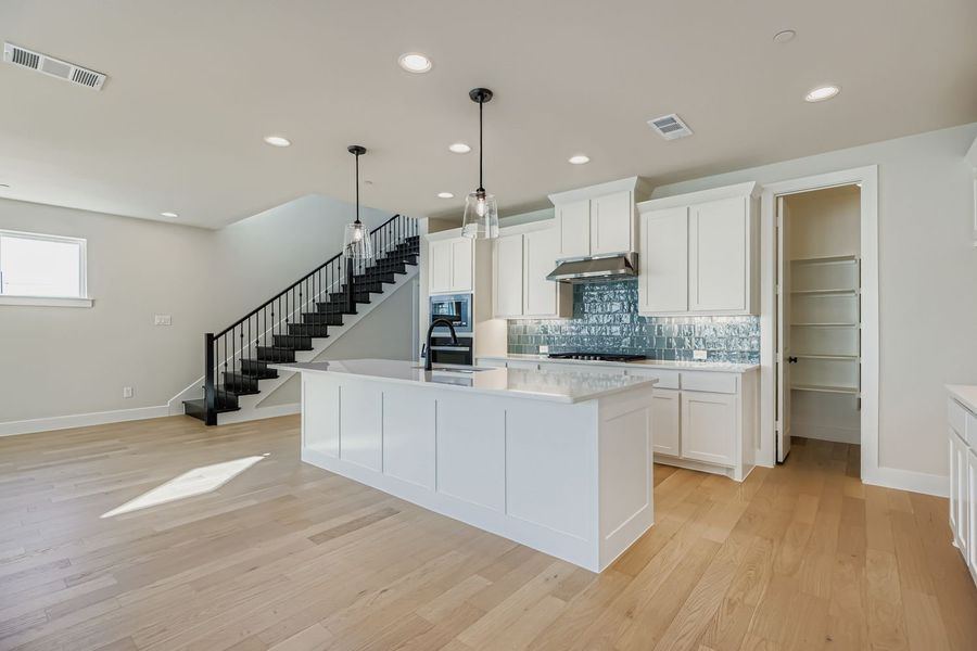 Furnished interior view inside a new home in Castle Hills Northpointe - Townhomes, Lewisville (Image 9).