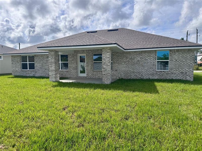 Front exterior of a new home in Palm Coast, Palm Coast, FL, highlighting curb appeal (Image 17). Front exterior of a new home in Palm Coast, Palm Coast, FL, highlighting curb appeal (Image 17).
