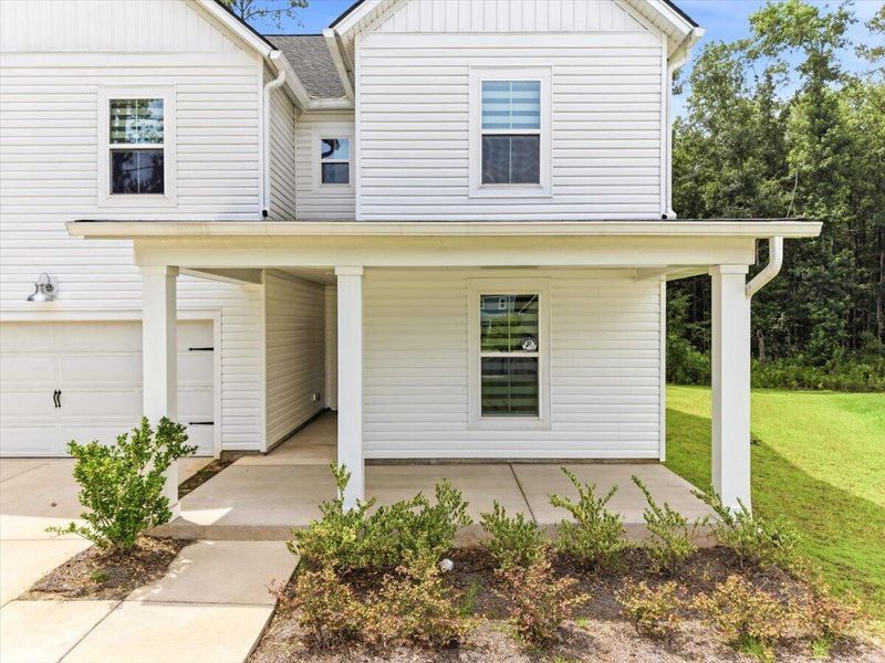 Exterior details and patio area of a home in Limehouse Village: Arbor Series, Summerville (Image 31).
