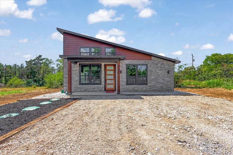 Front exterior of a new home in , Gordonville, TX, highlighting curb appeal (Image 16). Front exterior of a new home in , Gordonville, TX, highlighting curb appeal (Image 16).