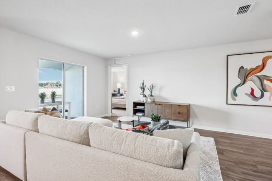 A living room with a couch and a table.